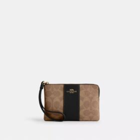 Bolsos de pulsera con cremallera en las esquinas, en Signature Canvas con rayas
