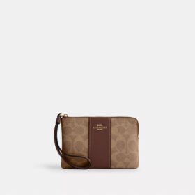 Bolsos de pulsera con cremallera en las esquinas, en Signature Canvas con rayas