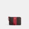 Bolsos de pulsera con cremallera en las esquinas, en Signature Canvas con rayas