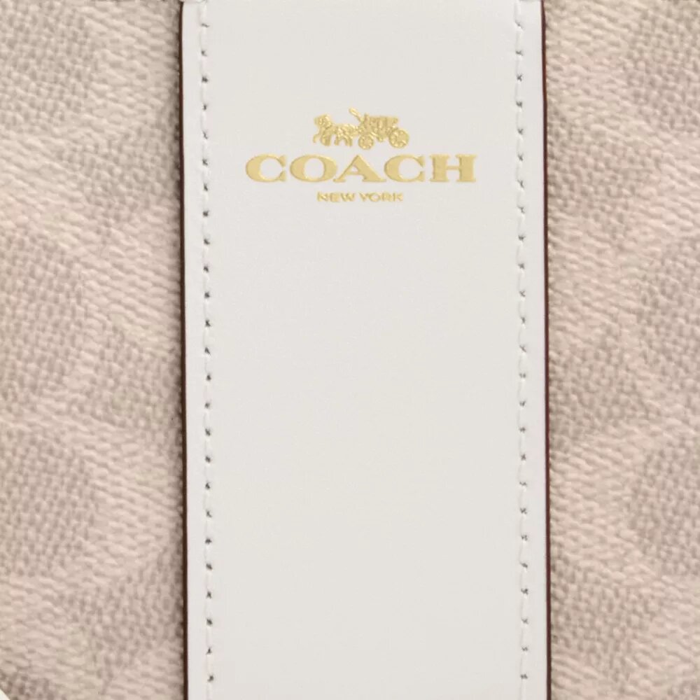 Bolsos de pulsera con cremallera en las esquinas, en Signature Canvas con rayas