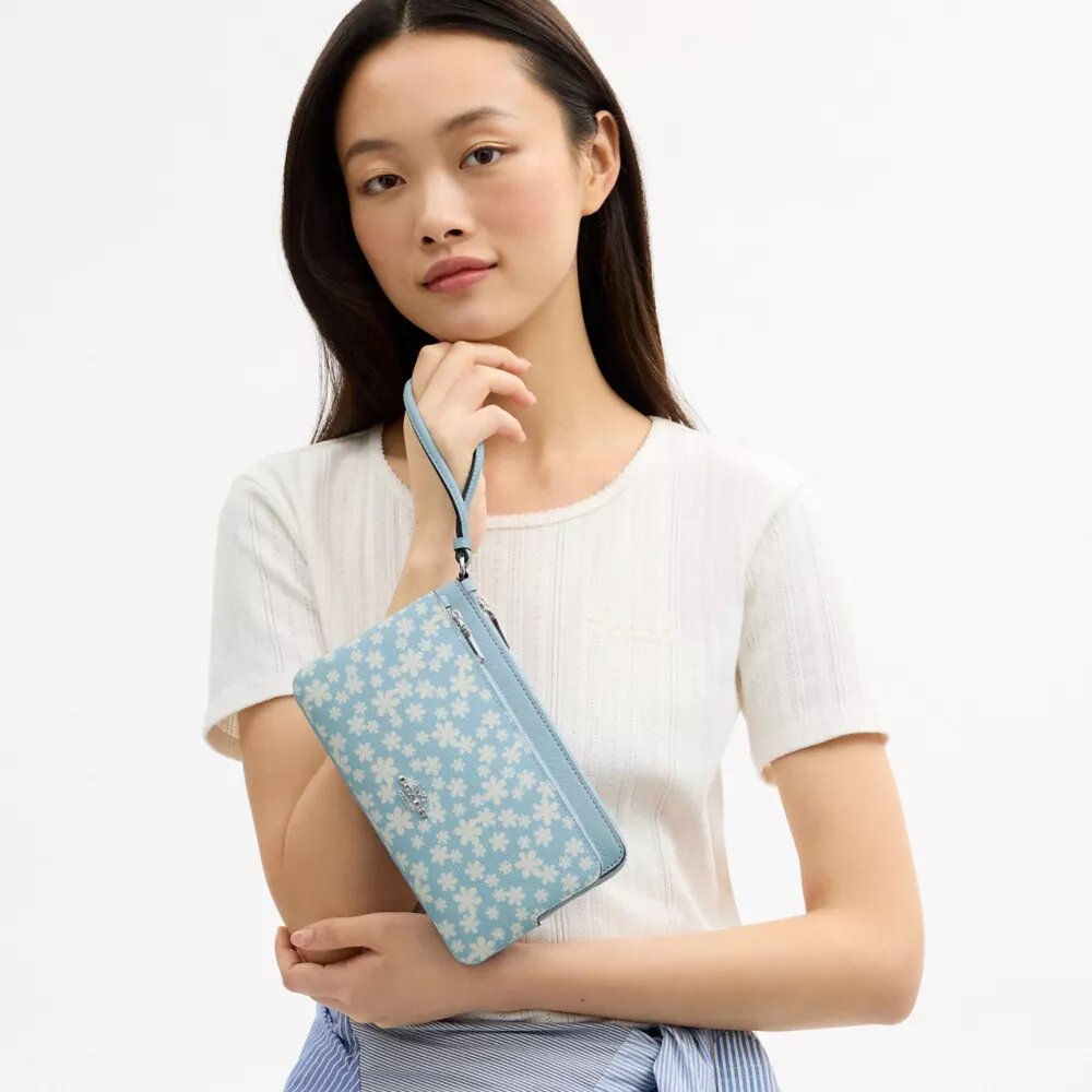 Bolsos de pulsera con doble cremallera y estampado floral