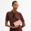 Bolsos de pulsera con doble cremallera y estampado floral