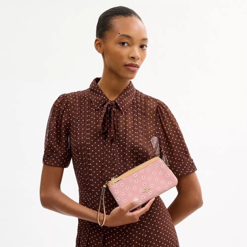 Bolsos de pulsera con doble cremallera y estampado floral