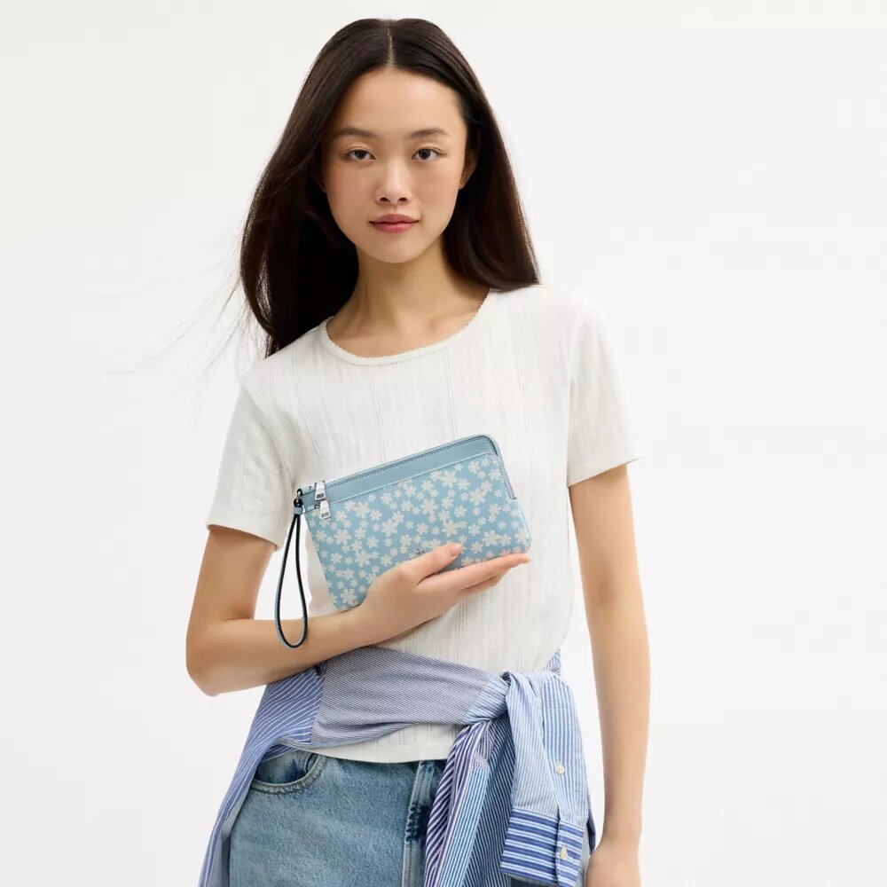 Bolsos de pulsera con doble cremallera y estampado floral