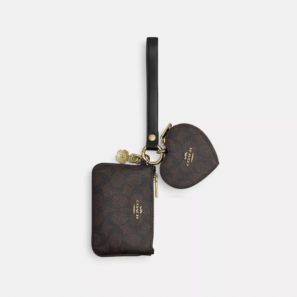 Bolsos de pulsera y neceser en forma de corazón en Signature Canvas con Charms
