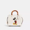 Bolsos Rogue 25 de Disney X Coach con Mickey Mouse