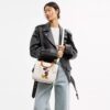Bolsos Rogue 25 de Disney X Coach con Mickey Mouse