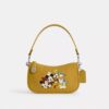 Bolsos Swinger de Disney x Coach en piel regenerativa con Mickey Mouse y sus amigos