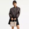 Bolsos Tote Mollie 25 en Signature Canvas