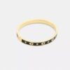 Brazalete con bisagra y letras «C» repetidas