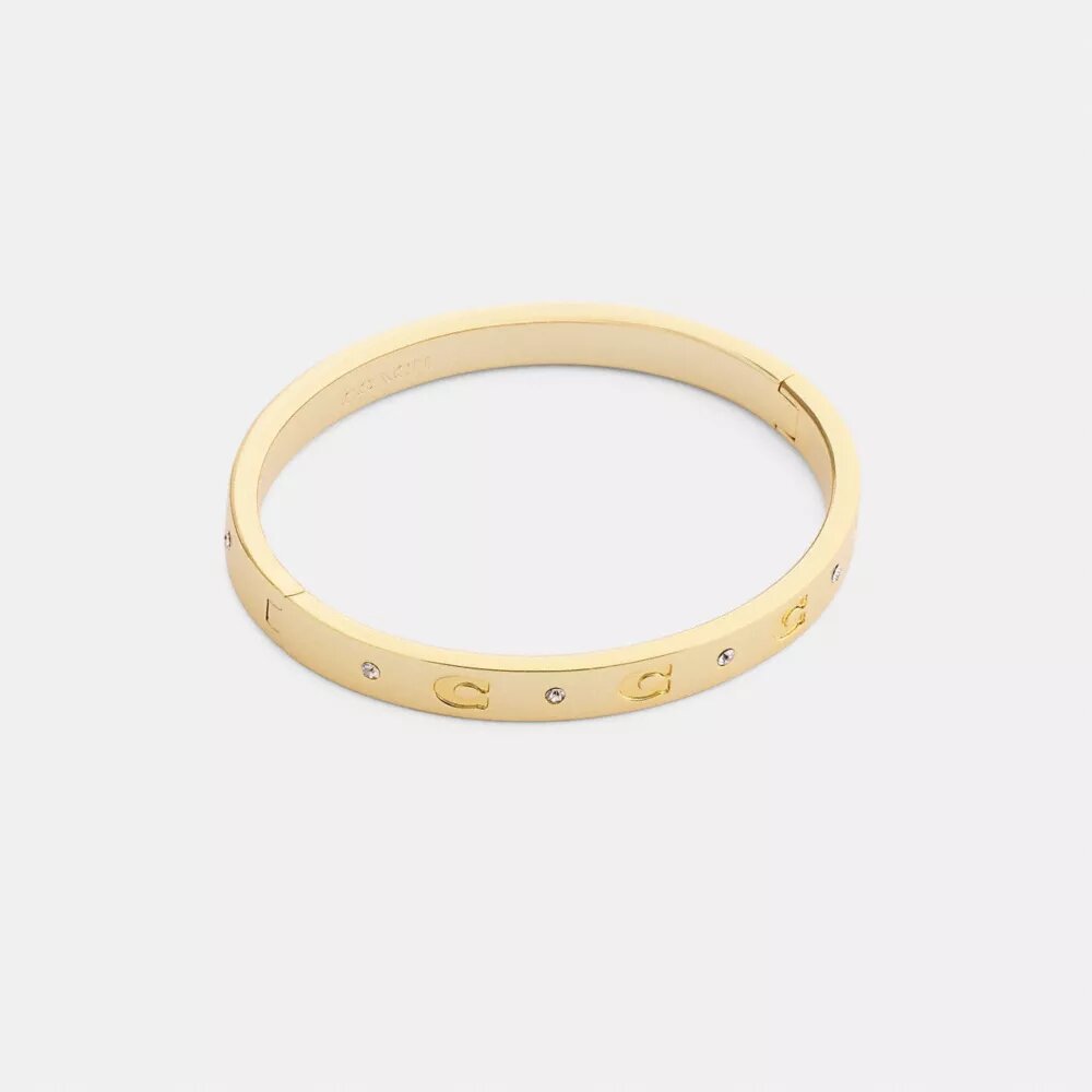 Brazalete con bisagra y letras «C» repetidas