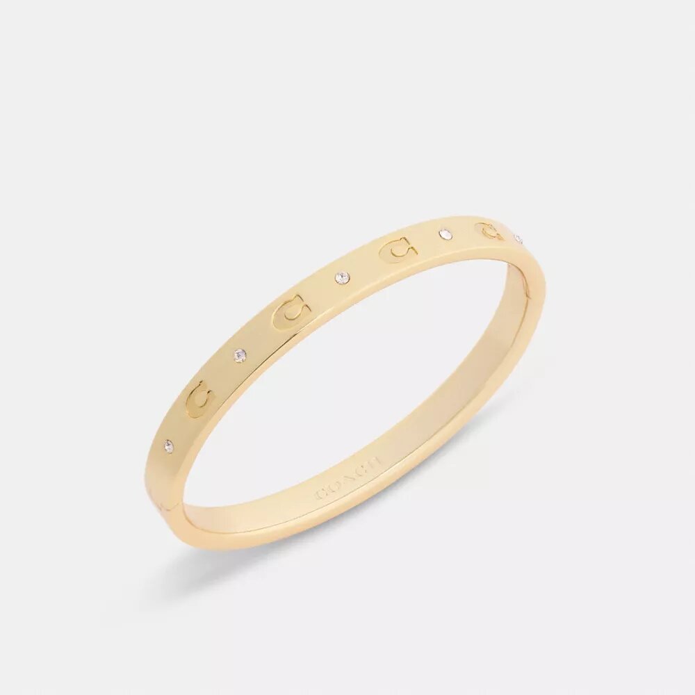 Brazalete con bisagra y letras «C» repetidas