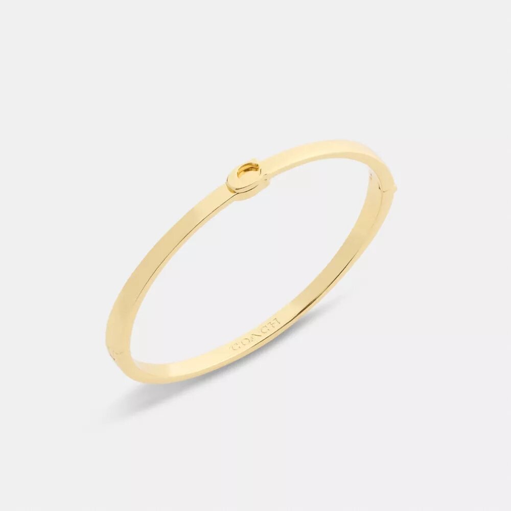 Brazalete fino con bisagra característico
