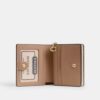 Cartera con cierre a presión, estampado floral y Charms