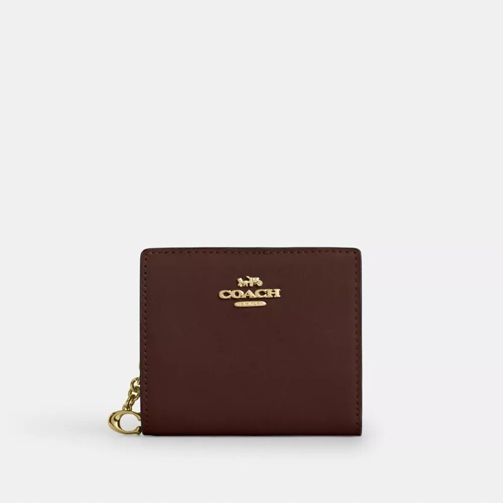 Cartera con cierre a presión y Charms