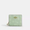 Cartera con cierre a presión y estampado floral
