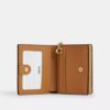 Cartera con cierre a presión y estampado floral