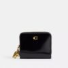 Cartera esencial con Charms