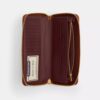 Cartera Essential Continental en Signature Canvas