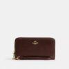 Cartera larga con cremallera envolvente