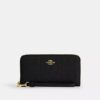 Cartera larga con cremallera envolvente en piel exclusiva