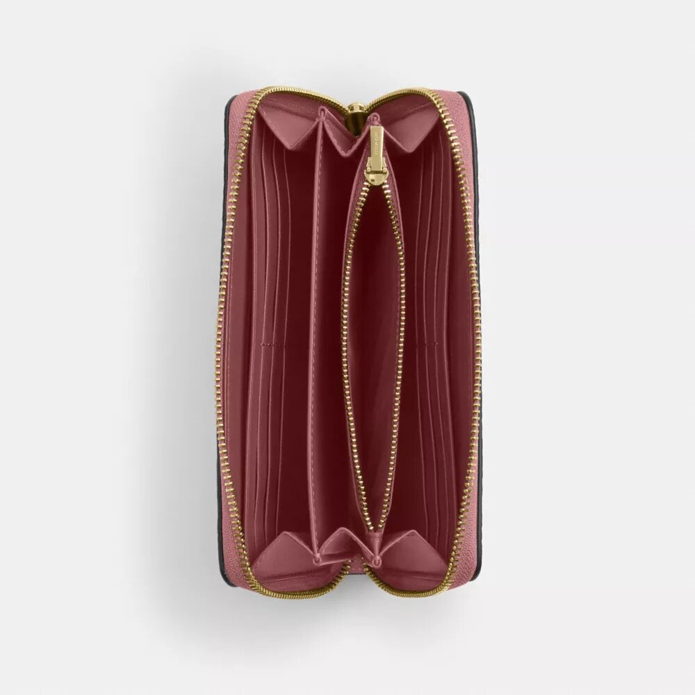 Cartera larga con cremallera envolvente en piel exclusiva