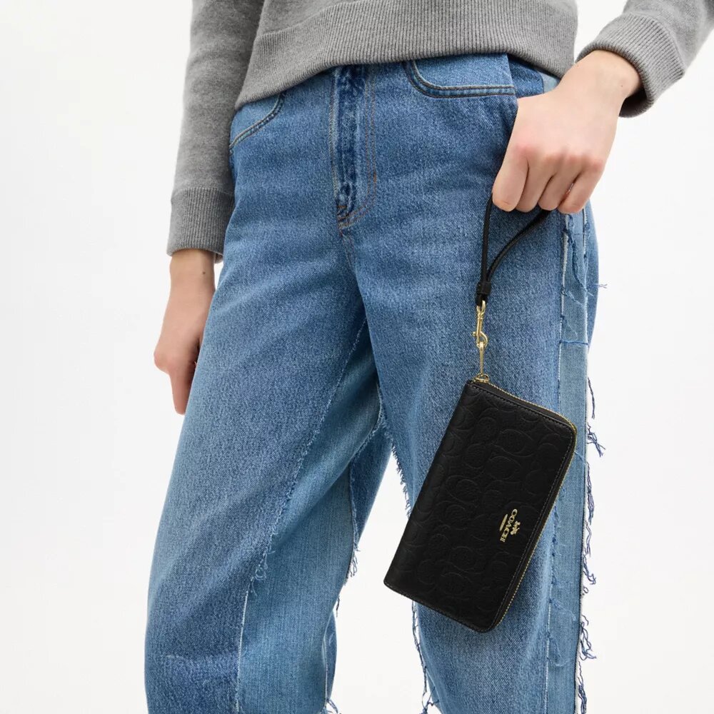 Cartera larga con cremallera envolvente en piel exclusiva