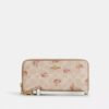 Cartera larga con cremallera envolvente en Signature Canvas con estampado floral