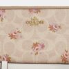 Cartera larga con cremallera envolvente en Signature Canvas con estampado floral