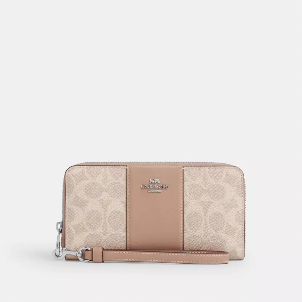 Cartera larga con cremallera envolvente en Signature Canvas con rayas