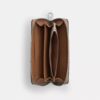 Cartera larga con cremallera envolvente en Signature Canvas con rayas