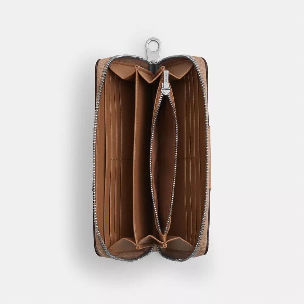 Cartera larga con cremallera envolvente en Signature Canvas con rayas