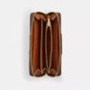 Cartera larga con cremallera envolvente en Signature Canvas con rayas