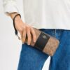 Cartera larga con cremallera envolvente en Signature Canvas con rayas