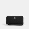 Cartera larga con cremallera perimetral en jacquard exclusivo