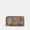 Cartera larga con cremallera perimetral en jacquard exclusivo con bordado floral