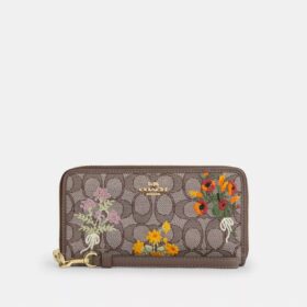 Cartera larga con cremallera perimetral en jacquard exclusivo con bordado floral