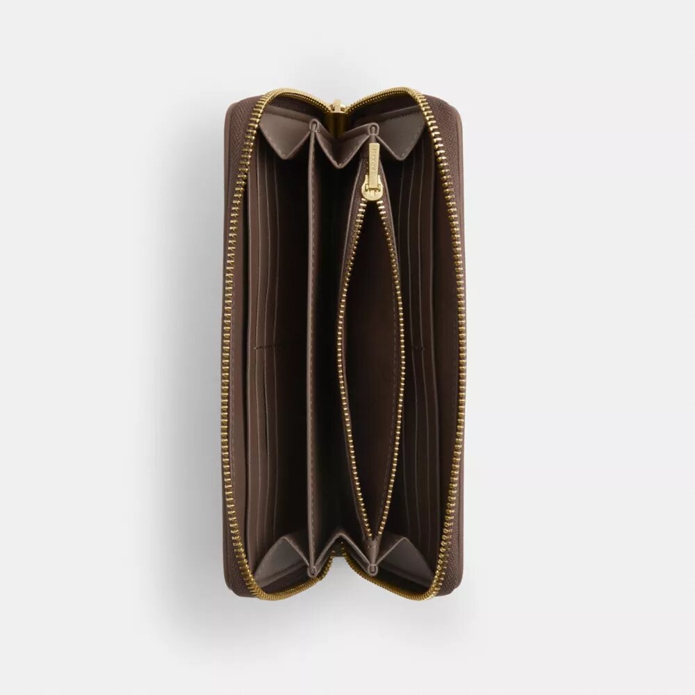 Cartera larga con cremallera perimetral en jacquard exclusivo con bordado floral