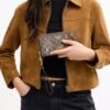 Cartera larga con cremallera perimetral en jacquard exclusivo con bordado floral