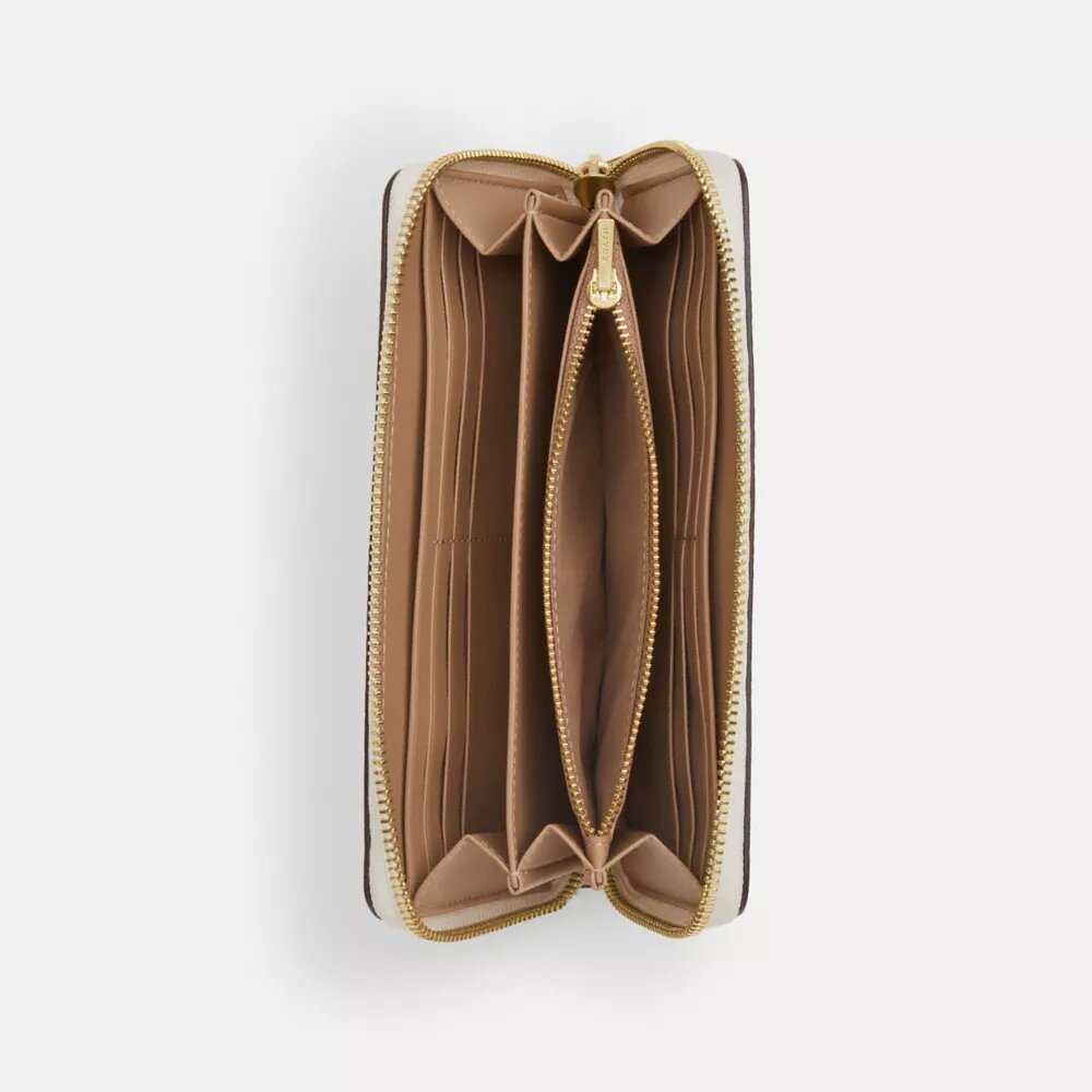 Cartera larga con cremallera perimetral en Signature Canvas