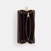 Cartera larga con cremallera perimetral en Signature Canvas