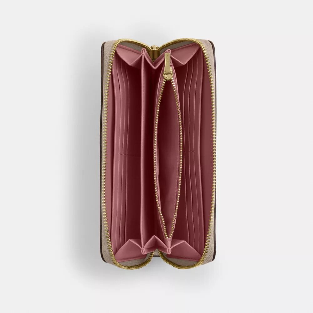 Cartera larga con cremallera perimetral en Signature Canvas