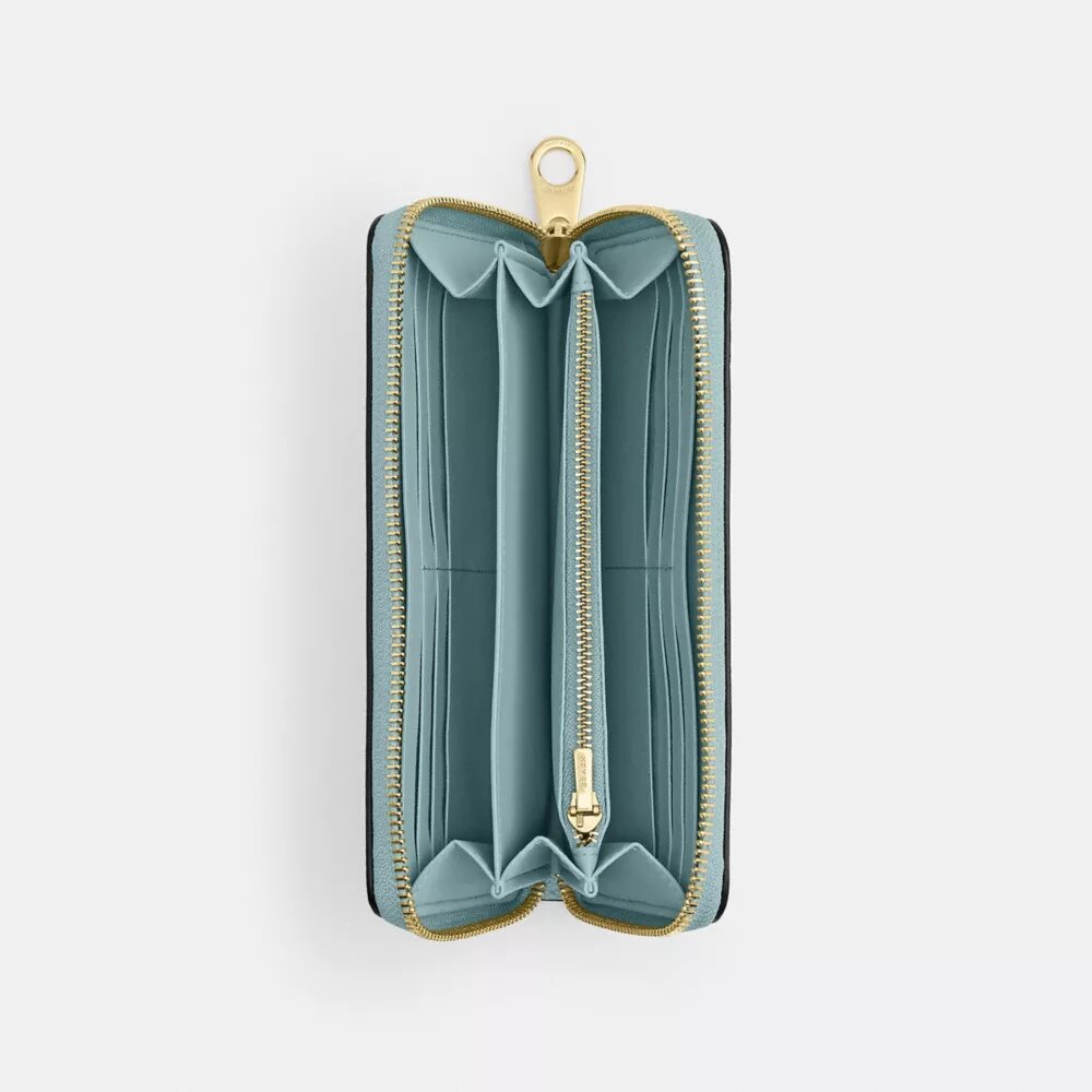 Cartera larga con cremallera perimetral en Signature Canvas