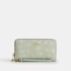 Cartera larga con cremallera perimetral y estampado floral