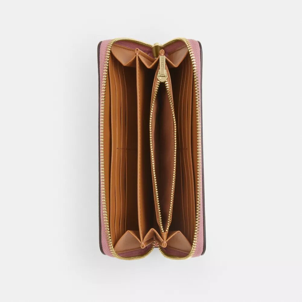 Cartera larga con cremallera perimetral y estampado floral