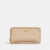 Cartera larga con cremallera perimetral y Signature Canvas