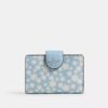 Cartera mediana con cremallera en esquina y estampado floral