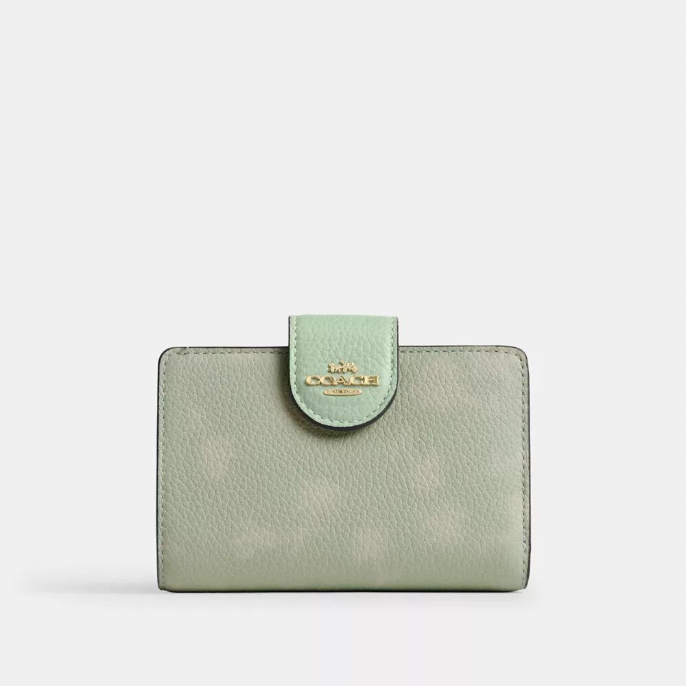 Cartera mediana con cremallera en esquina y estampado floral