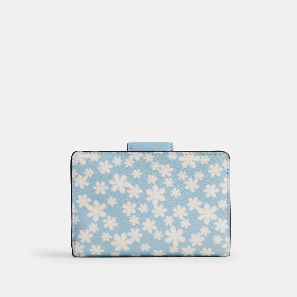 Cartera mediana con cremallera en esquina y estampado floral