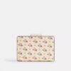 Cartera mediana con cremallera en esquina y estampado floral